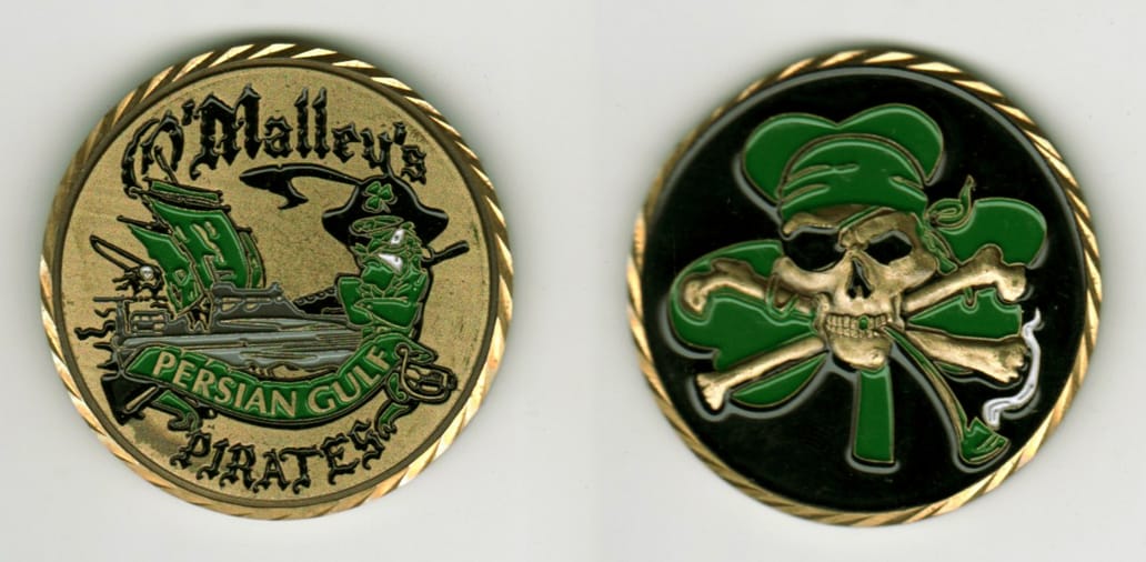 Round shaped, brass colored coin, 1 11/16 inches in diameter.