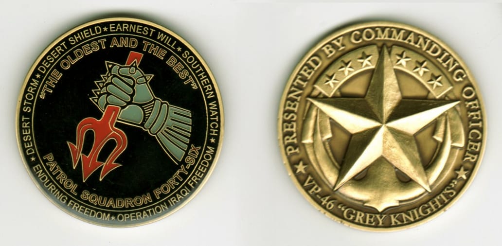 Round shaped, brass colored coin, 1 11/16 inches in diameter.