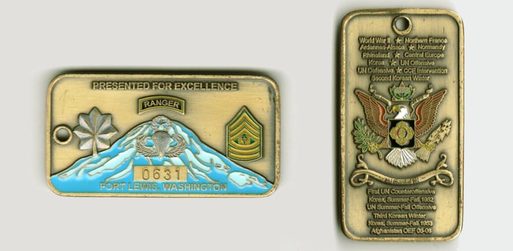 Retangular shaped, brass colored coin, 1 1/4 inches high x 3 inches wide.