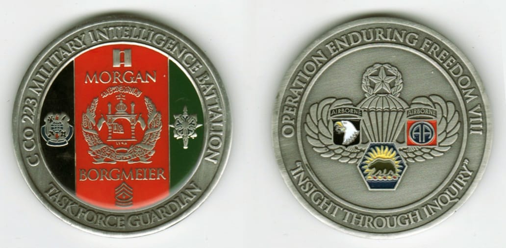 Round shaped, silver colored coin, 2  inches in diameter.