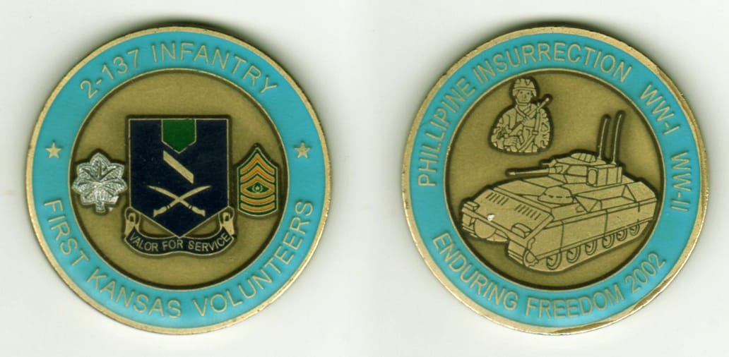 Round shaped, brass colored coin, 1 9/16  inches in diameter.