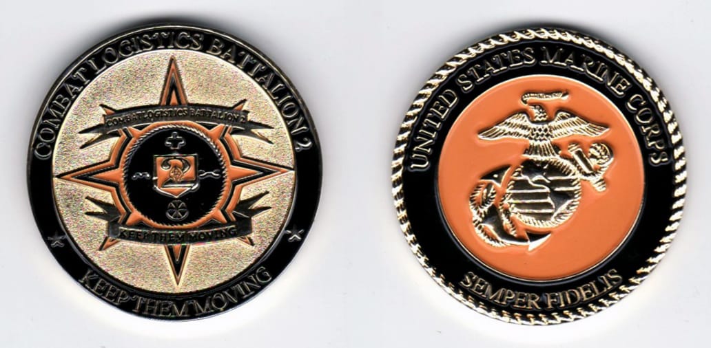 Round shaped, gold colored coin, 1 1/4  inches in diameter.