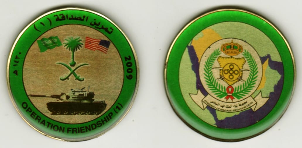 Round shaped, brass colored coin, 1 13/16  inches in diameter.