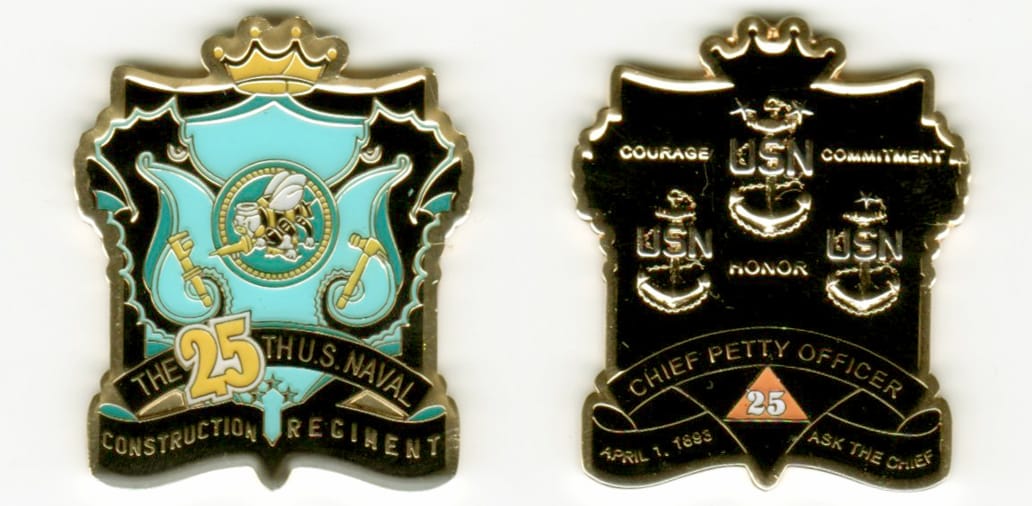 Shield shaped with a crown mounted above, gold colored coin, 1 1/2 inches wide x 1 3/4 inches high.