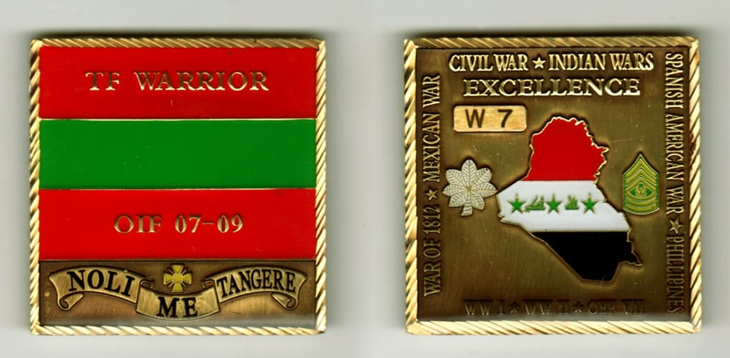 Square shaped, brass colored coin, 2 inches wide x 2 inches high.