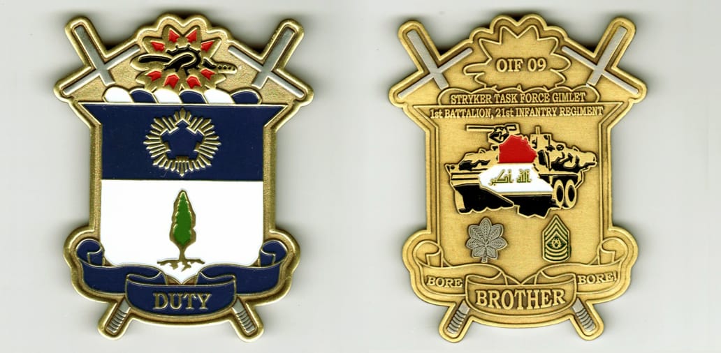 Shield shaped with crossed batons extended , brass colored coin, 1 3/4inches wide x 3 inches high.