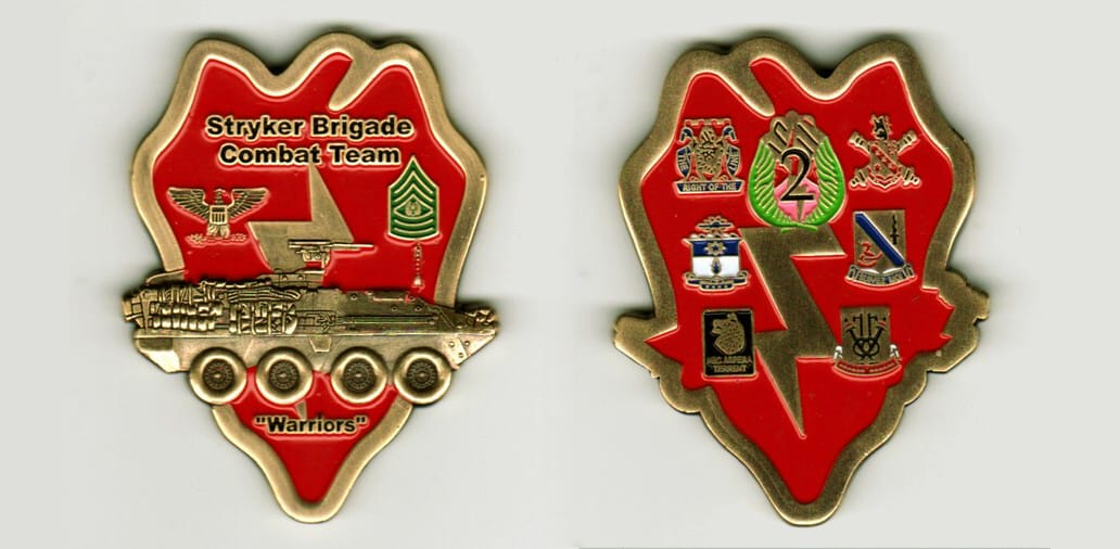 25th ID patch shaped, brass colored coin, 1 1/2 inches wide x 2  1/2 inches high.