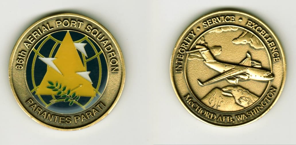 Round shaped, brass colored coin, 1 9/16  inches in diameter.