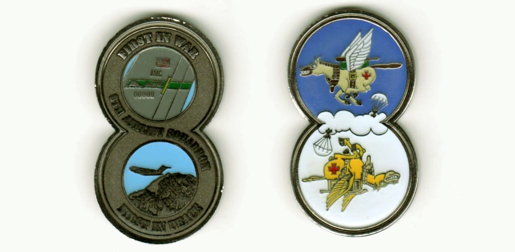 Figure 8 shaped, pewter colored coin, 1 inch wide x 2 inches high.