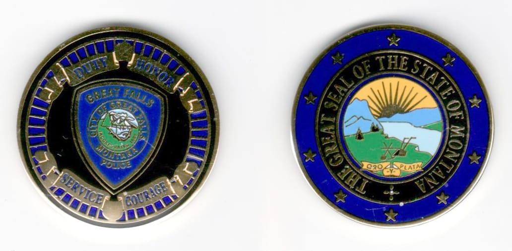 Round shaped, gold colored coin, 1 3/8  inches in diameter.