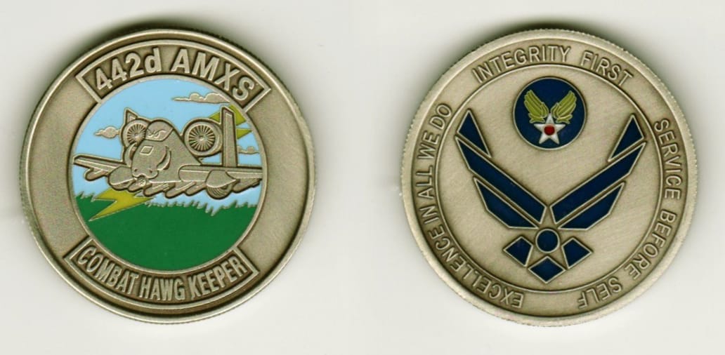 Round shaped, gold colored coin, 1 3/8  inches in diameter.