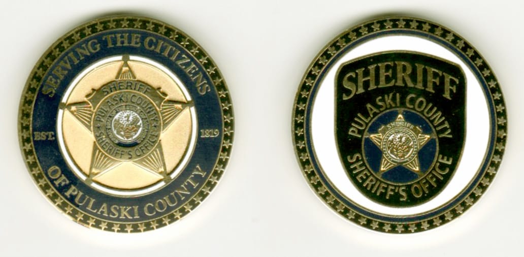 Round shaped, gold colored coin, 1 3/8  inches in diameter.