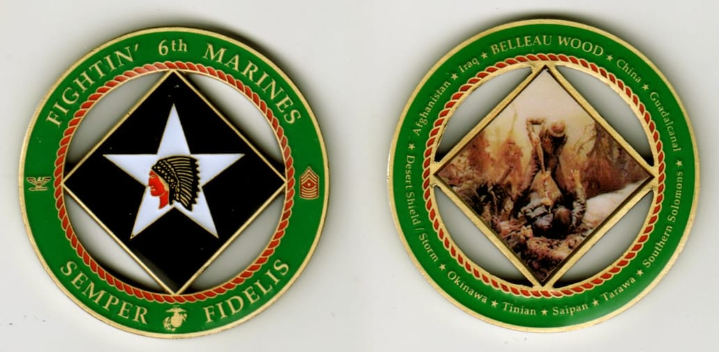 Round shaped, brass colored coin with cut out areas, 2 inches in diameter.