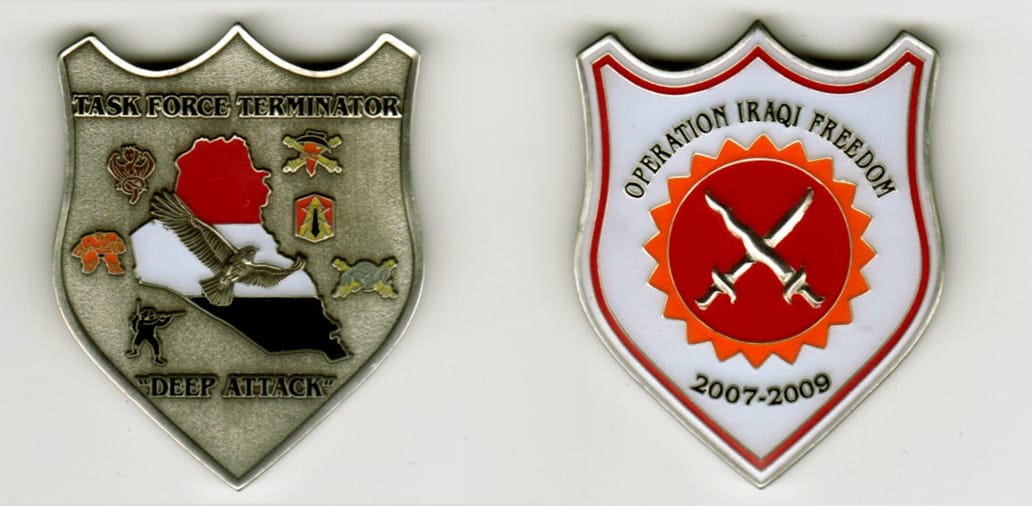 Shield shaped, silver colored coin, 1 1/2  inches wide x 2 inches high.