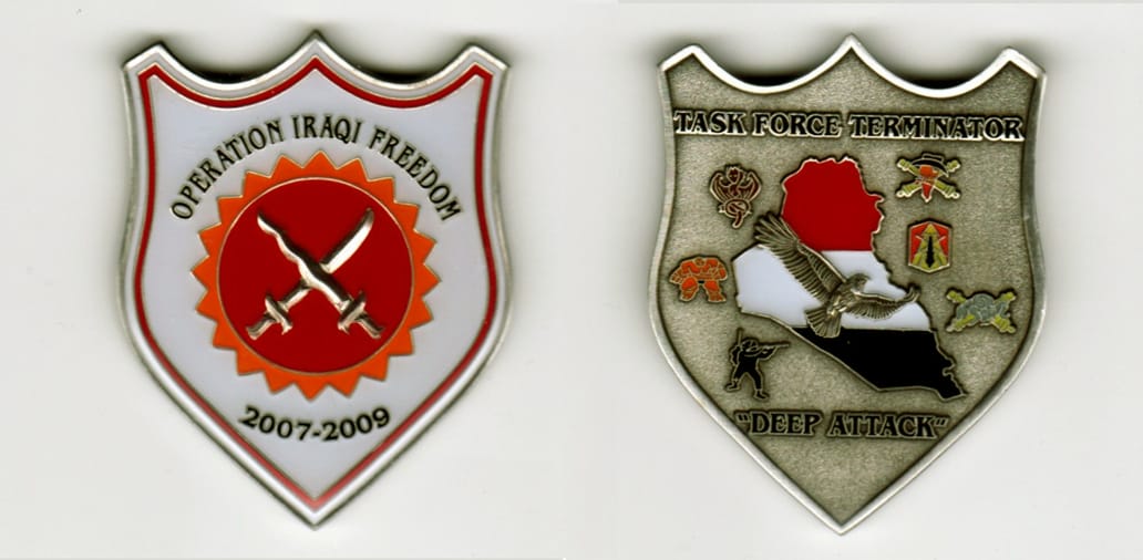 Shield shaped, silver colored coin, 1 1/2  inches wide x 2 inches high.