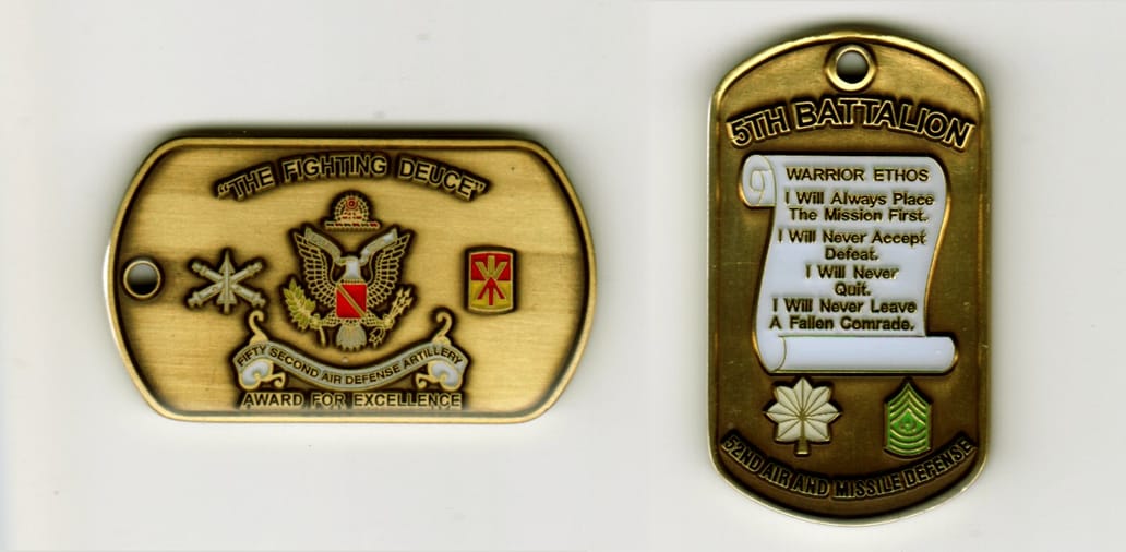 Dog tag shaped, brass colored coin, 1 1/4  inches  x 2 inches.