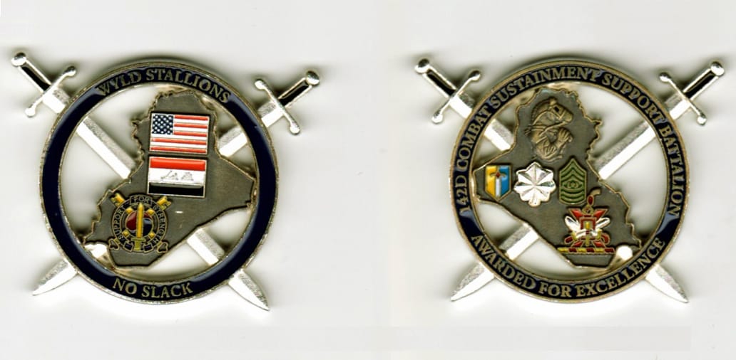 Round shaped, silver colored coin withinterior cut out area and crossed swords extending, 1 1/2  inches in diameter(incl...