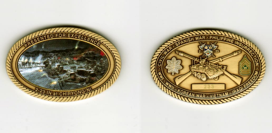 Oval shaped, brass colored coin, 1 1/2  inches in diameter.