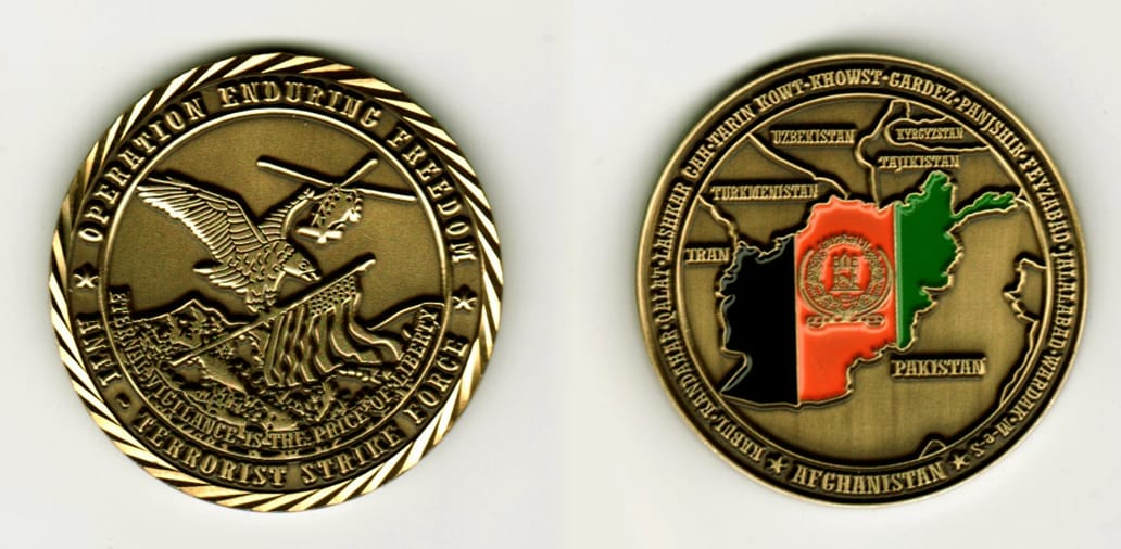 Round shaped, brass colored coin, 1 11/16  inches in diameter.