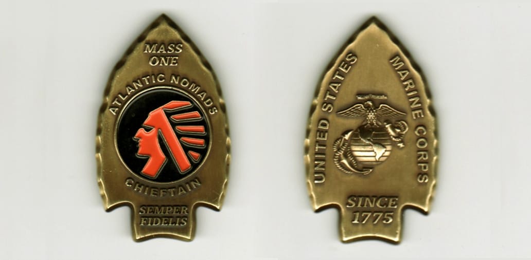 Arrowhead shaped, antique brass colored coin 1 inch wide x 2 inches high.