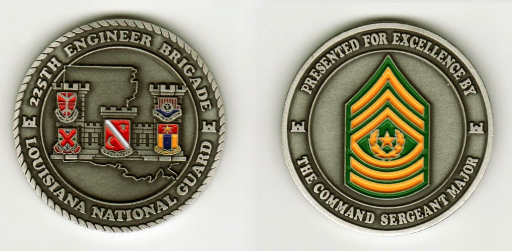 Round shaped, pewter colored coin, 2  inches in diameter.