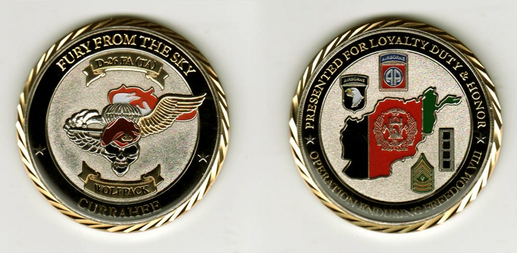 Round shaped, silver colored coin, 2 inches in diameter.