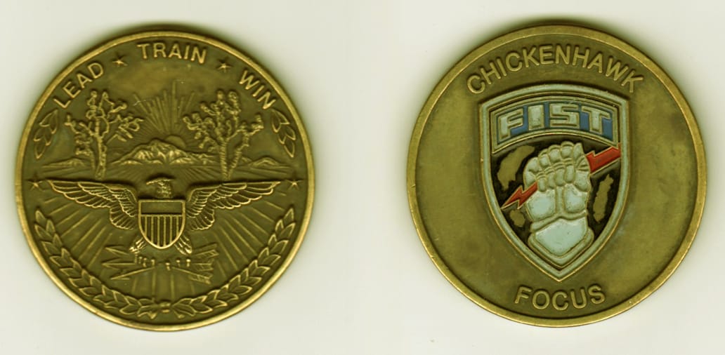 Round shaped, brass colored coin, 2  1/8 inches in diameter.