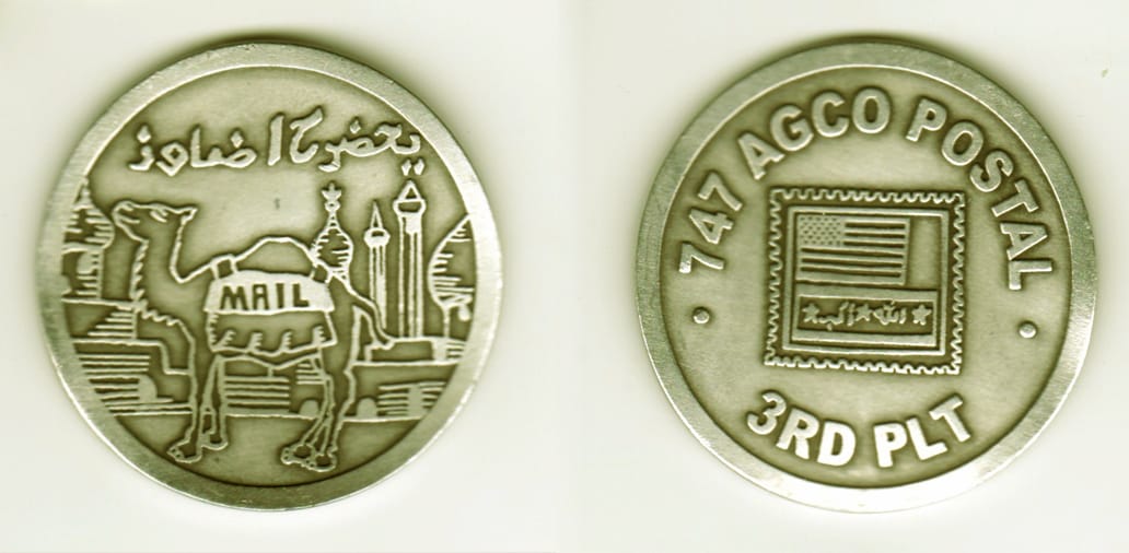 Round shaped, silver colored coin, 2 1/8 inches in diameter.