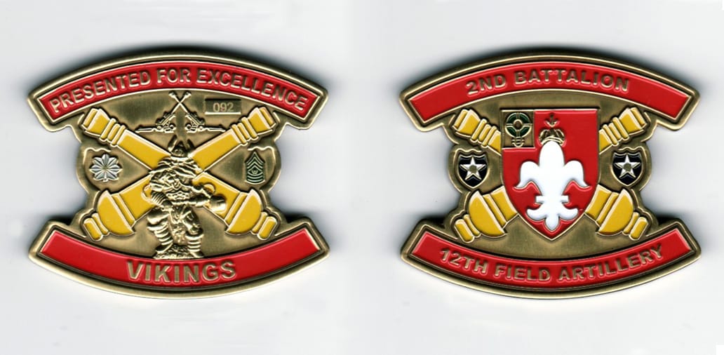 Oval shaped with sides notched, brass colored coin, 2  inches wide x 1 1/2 inches high.