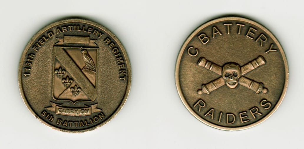 Round shaped, brass colored coin, 1 1/2  inches in diameter.