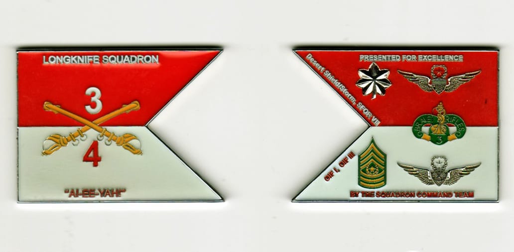 Flag shaped, brass colored, enameled coin 2 inches wide x 1-1/2 inches high.