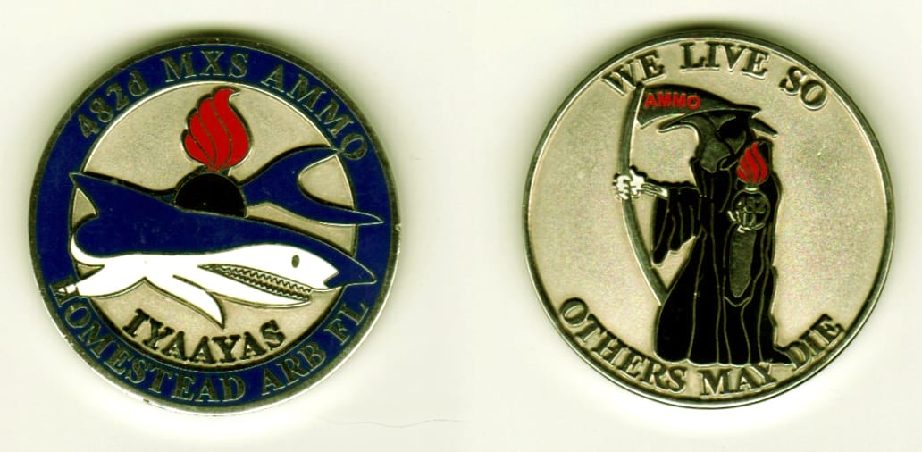 Round shaped, silver colored coin, 1 1/2  inches in diameter.