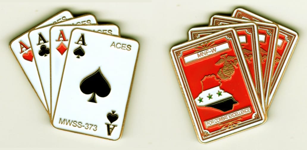 Four fanned out playing cards shaped, brass colored,  2 inches high x 1-1/2 inches wide.