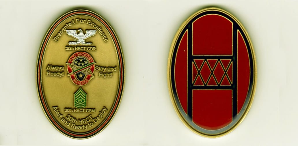 Oval shaped, gold colored coin, 1 1/2 inches wide x 2 1/4  inches high.