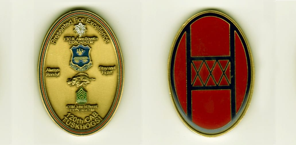 Oval shaped, gold colored coin, 1 1/2 inches wide x 2 1/4  inches high.