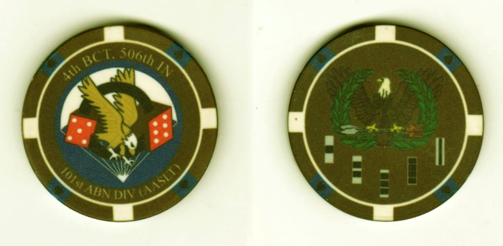 Round shaped, brown and white plastic poker chip, 1 3/8  inches in diameter.