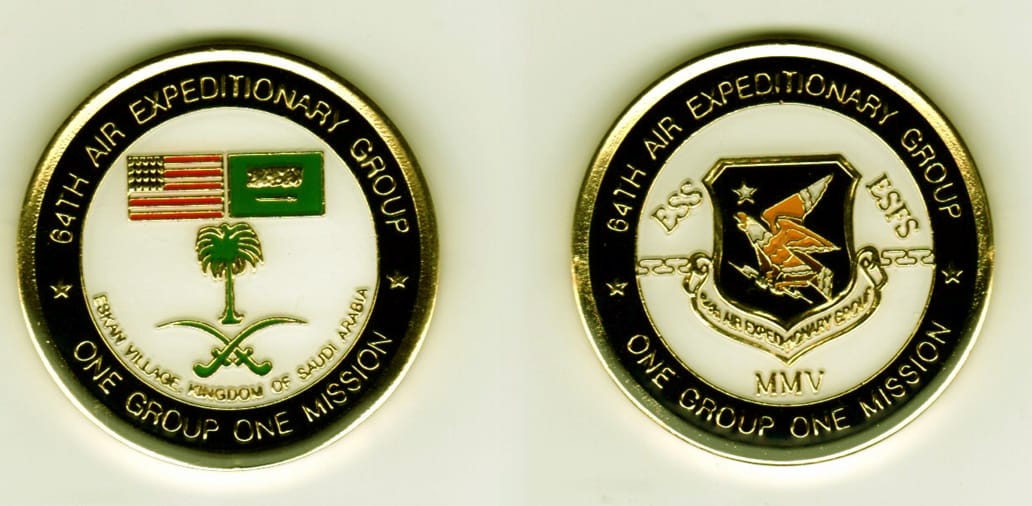 Round shaped, gold colored coin, 1 9/16  inches in diameter.