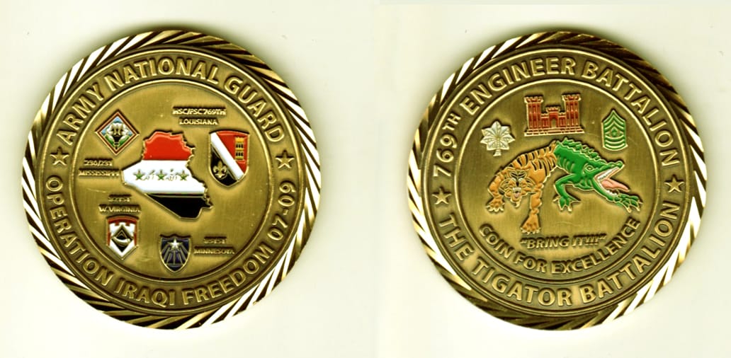 Round shaped, gold colored coin, 1 13/16  inches in diameter.