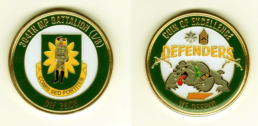 Round shaped, gold colored coin, 2 1/8  inches in diameter.