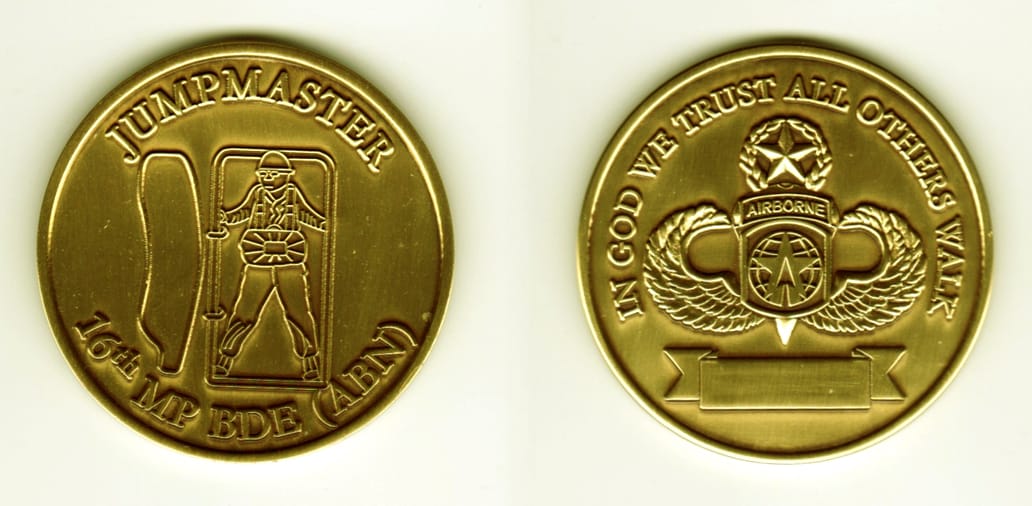 Round shaped, brass colored coin, 2 1/8  inches in diameter.