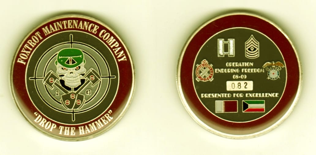 Round shaped, gold colored coin, 1 11/16  inches in diameter.