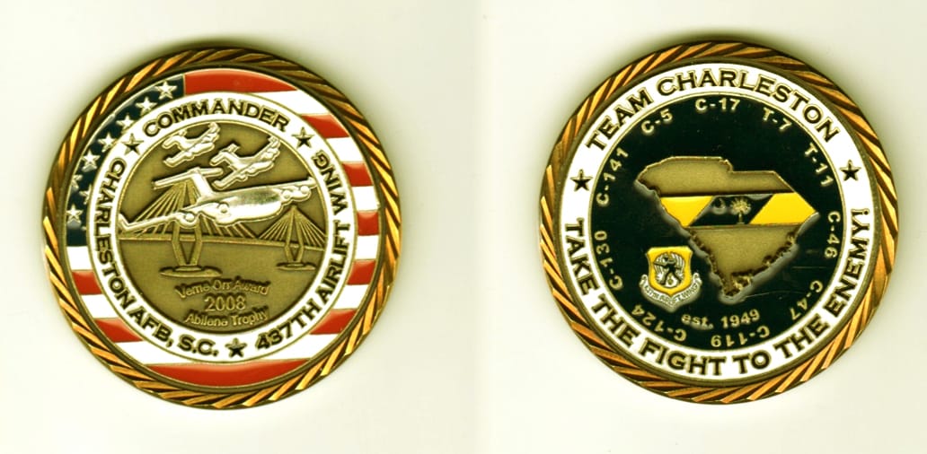 Round shaped, brass colored coin, 1 11/16  inches in diameter.