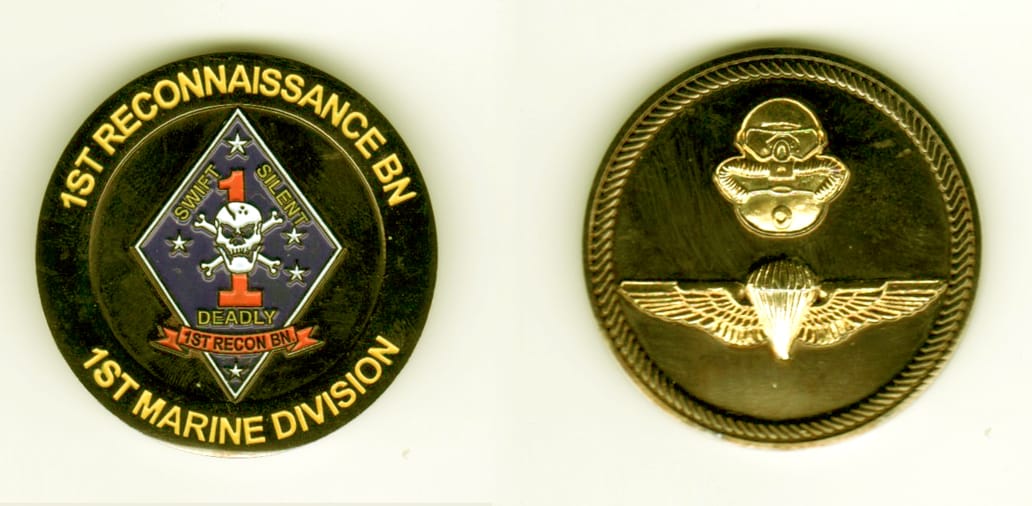 Round shaped, brass colored coin, 1 11/16  inches in diameter.