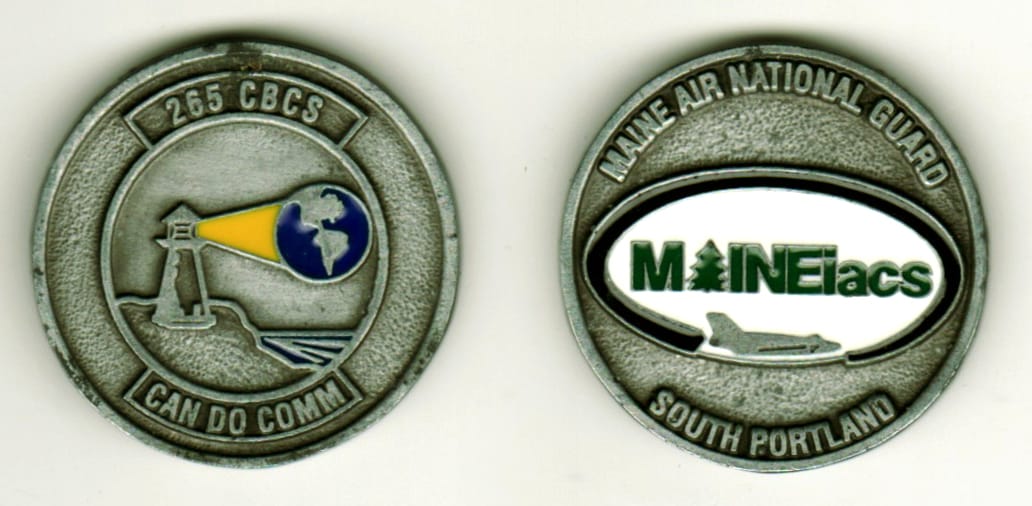 Round shaped, pewter colored coin, 1 3/8  inches in diameter.