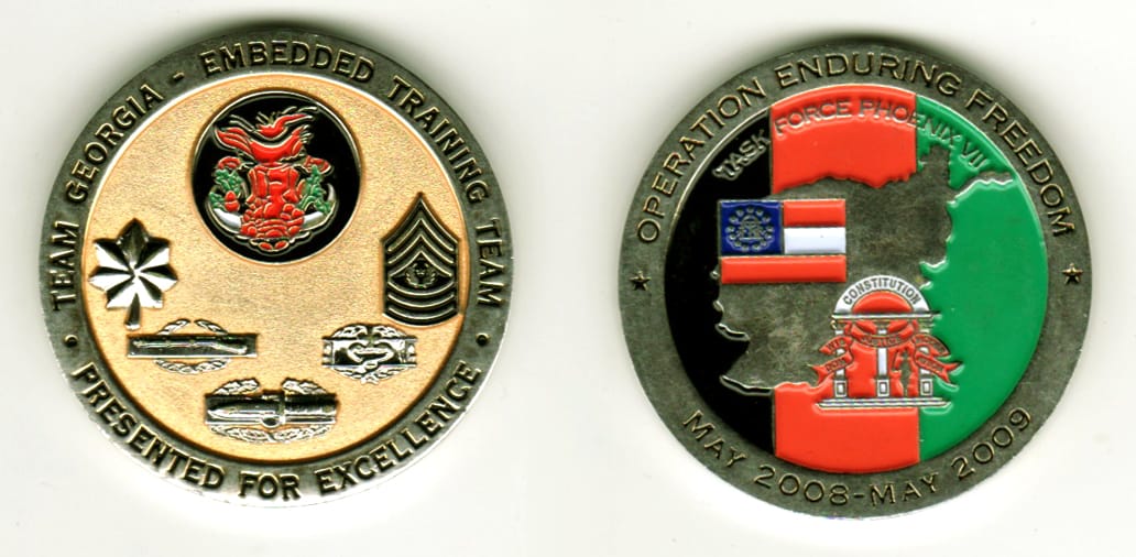 Round shaped, silver colored coin, 1 11/16  inches in diameter.