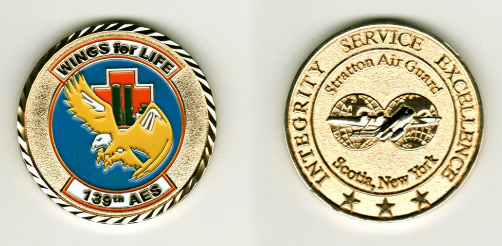 Round shaped, gold colored coin, 1 11/16  inches in diameter.