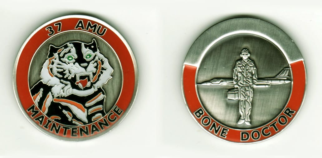 Round shaped, pewter colored coin, 1 11/16  inches in diameter.