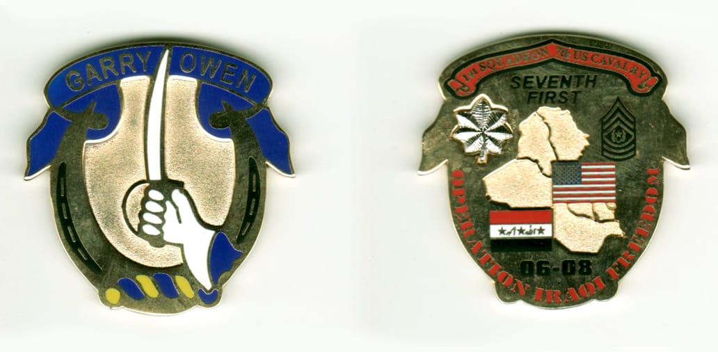 Reverted horseshoe shaped with banner mounted above, gold colored coin, 1 1/2  inches high x 1 1/2 inches wide.