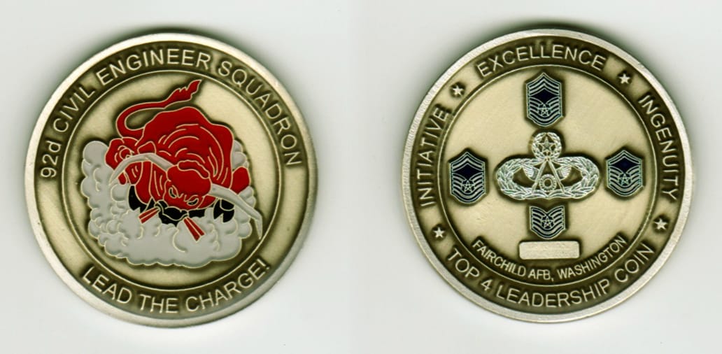 Round shaped, antique silver colored coin, 1 11/16  inches in diameter.