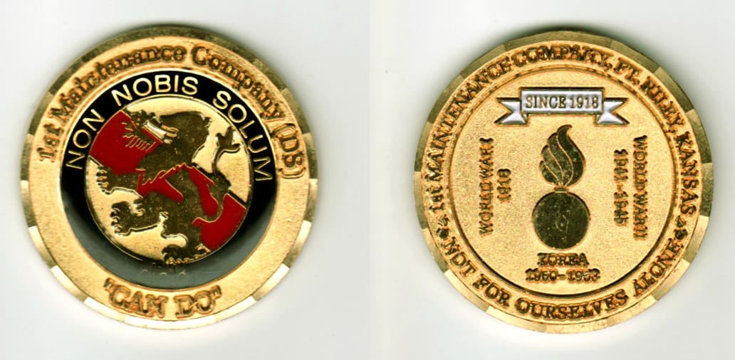 Round shaped, gold colored coin, 1 11/16  inches in diameter.